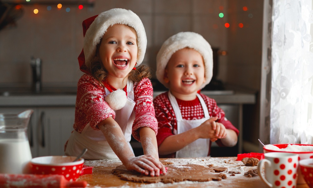 Kids making gingerbread cookies; holiday recipes that are braces friendly